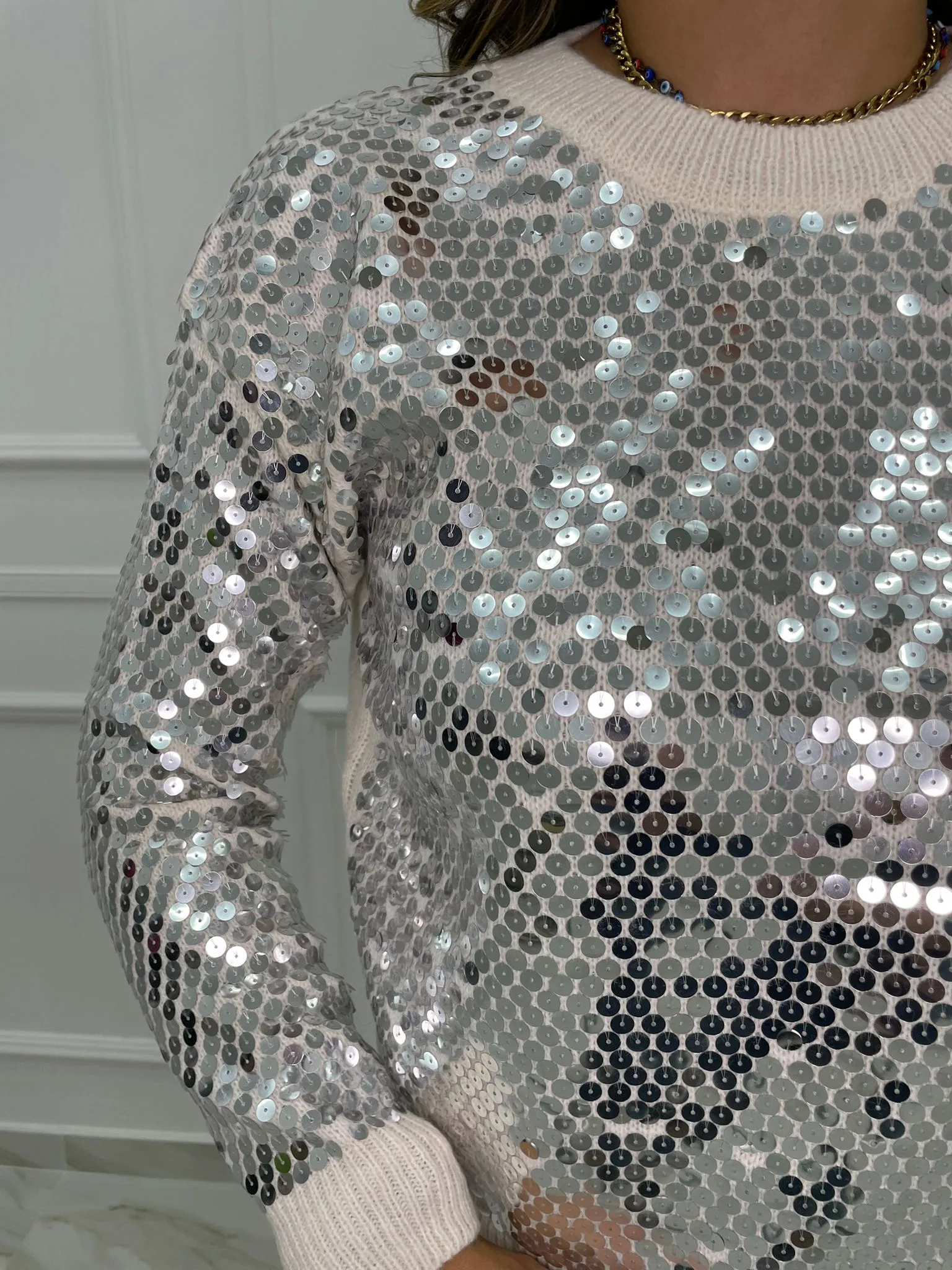 Maglione tinta unita con paillettes