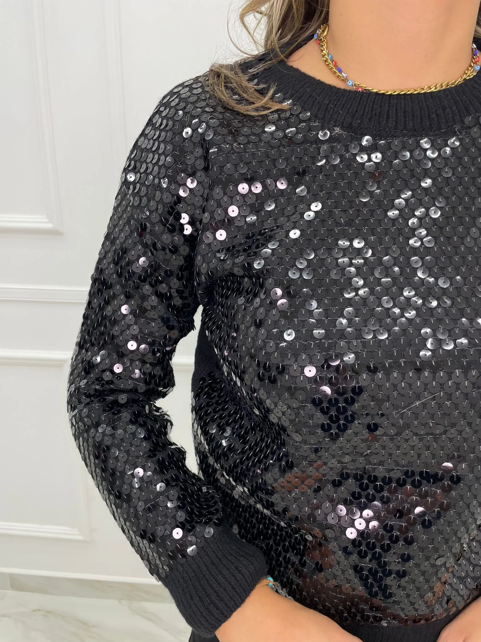 Maglione tinta unita con paillettes