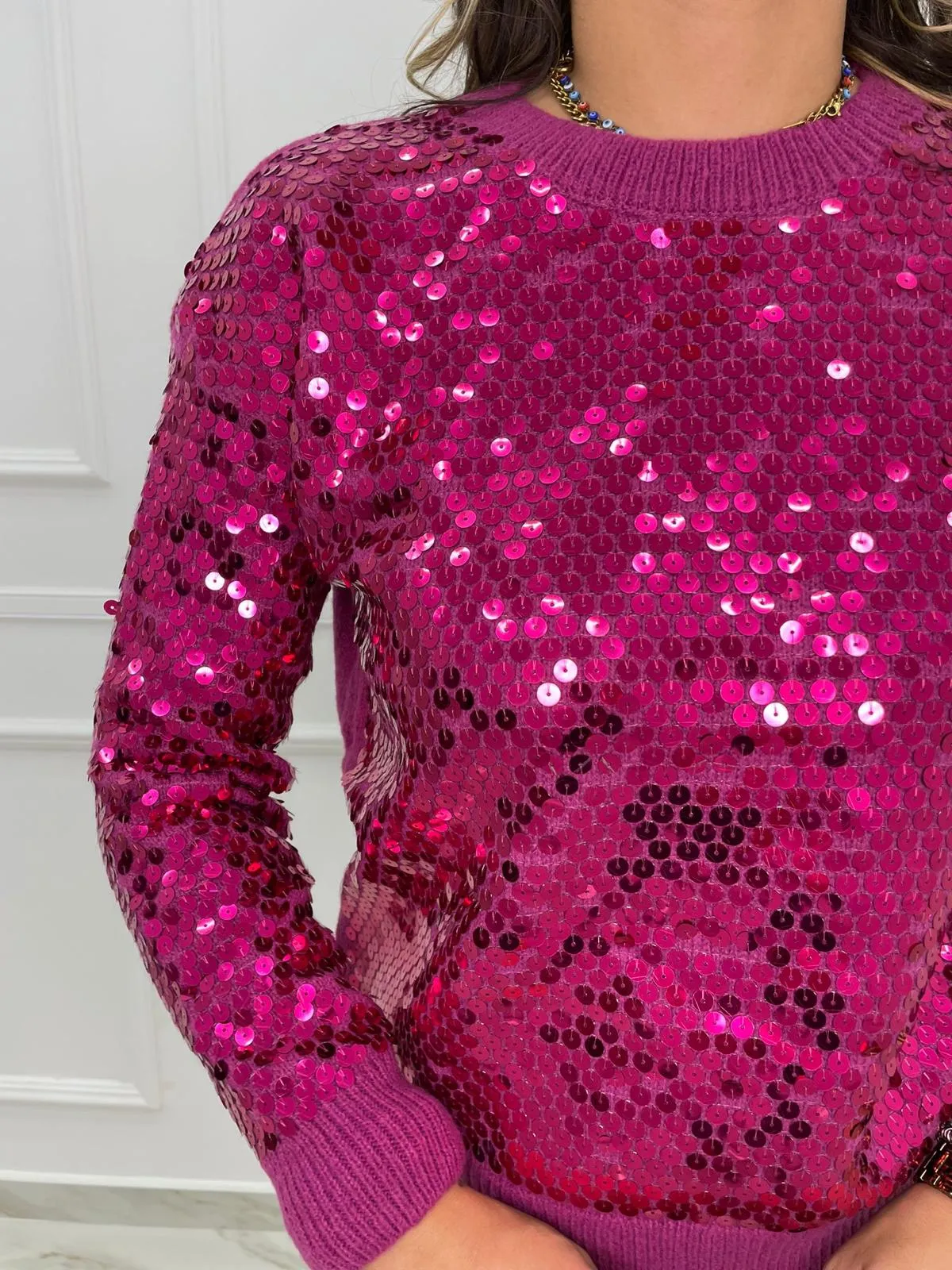 Maglione tinta unita con paillettes