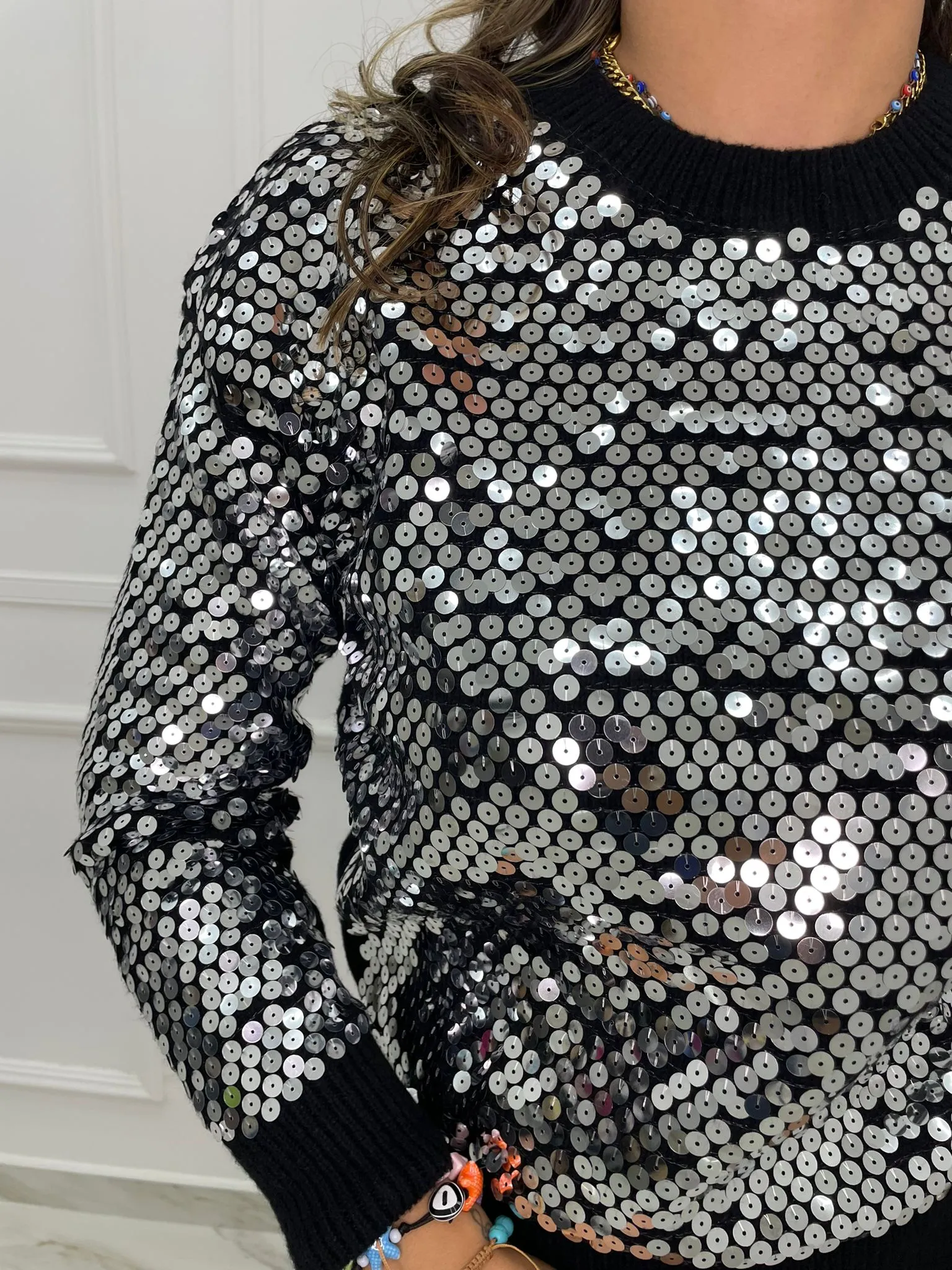 Maglione tinta unita con paillettes